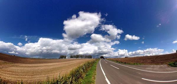 Road passing through field