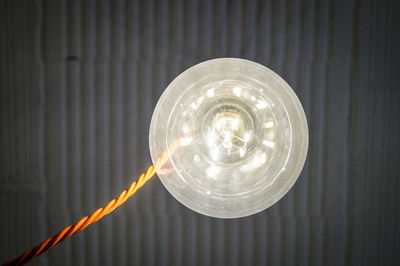 Close-up of light bulb on table