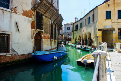Boats moored in canal