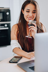 Young woman using mobile phone