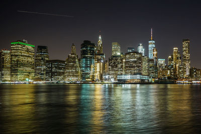 Illuminated city at waterfront