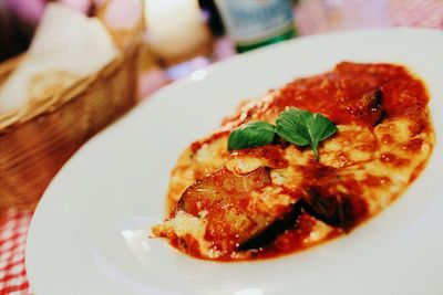 Close-up of parmigiana served on table