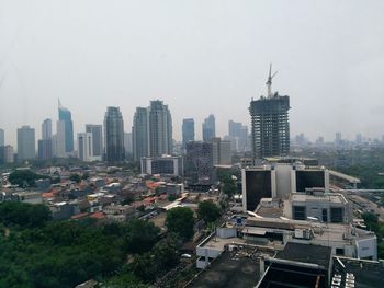 High angle view of buildings in city against sky