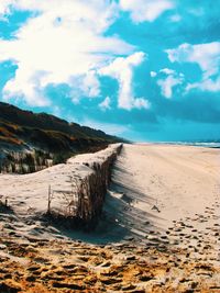 Scenic view of beach against sky