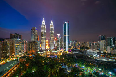 Illuminated buildings in city at night