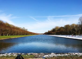 Scenic view of lake against blue sky