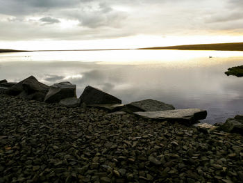 Scenic view of sea against cloudy sky