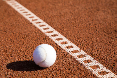 Close-up of tennis ball on court