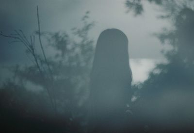 Low angle view of silhouette woman against sky