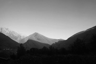 Scenic view of snowcapped mountains against clear sky