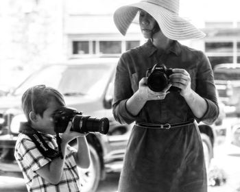 Rear view of people photographing