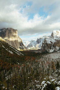 Scenic view of snowcapped mountains against sky