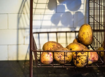 Fresh potatoes in the corner lit by the sun. selective focus on potatoes.