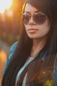 Portrait of a young woman wearing sunglasses