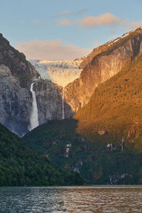 Ventisquero colgante, a hanging glacier with waterfall and lake in queulat national park, chile