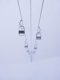 Ski lifts over snowy mountain