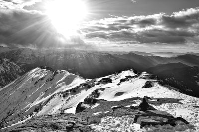 Scenic view of snowcapped mountains against sky