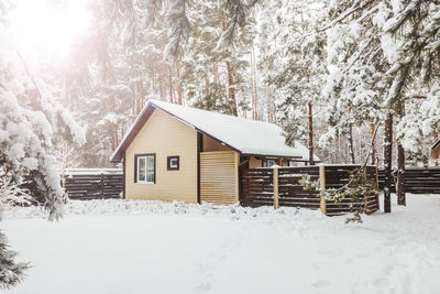 House on snow covered field