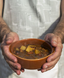 Close-up of man holding bowl