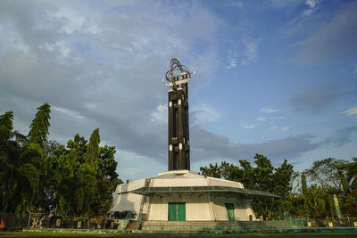 Low angle view of bell tower against sky