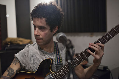 Young man playing guitar