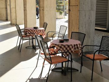 Empty chairs and tables in cafe