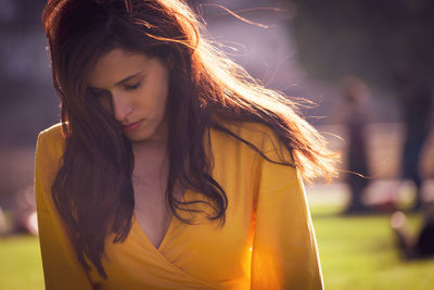 Close-up of woman with eyes closed outdoors