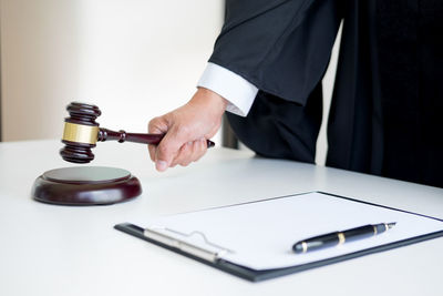 Close-up of man hand on table