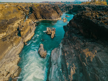 High angle view of rocks in sea