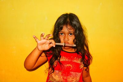 Portrait of a girl holding yellow