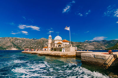 View of buildings against blue sky