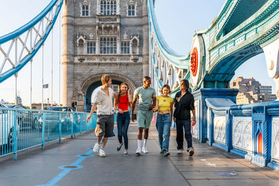 Rear view of people walking in city