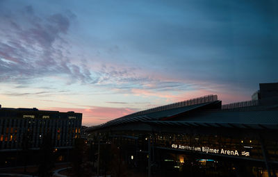 Low angle view of illuminated bridge against sky at sunset