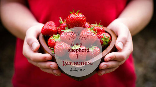 Close-up of hand holding strawberry