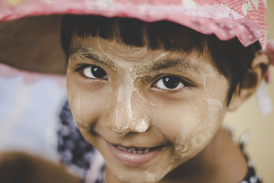 Close-up portrait of smiling boy