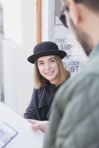 Young woman smiling at her boyfriend