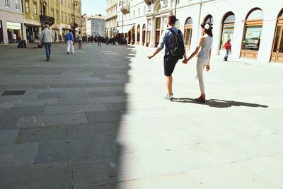 Full length of woman walking in city