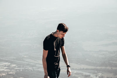 Full length of young man looking at mountain