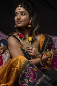 Portrait of young woman looking away