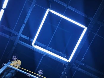 Low angle view of illuminated ceiling