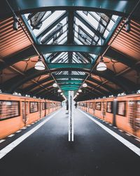 Blurred motion of trains at railroad station platform