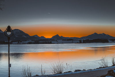 Scenic view of sea against orange sky