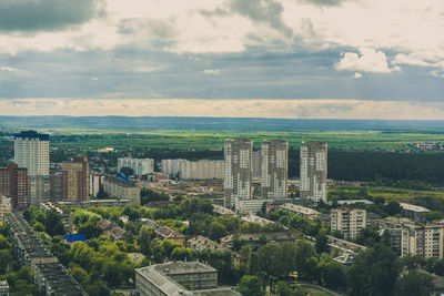 High angle view of buildings in city against sky