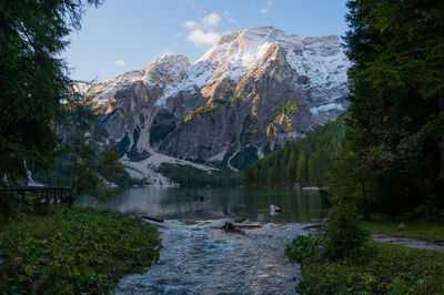 Scenic view of lake and mountains against sky