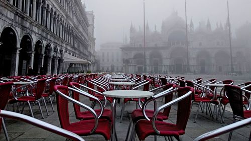 Empty chairs in a city