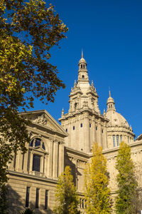 Low angle view of building against clear blue sky