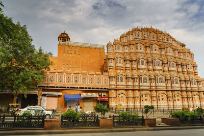 Low angle view of historical building against cloudy sky