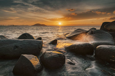 Scenic view of sea against sky during sunset