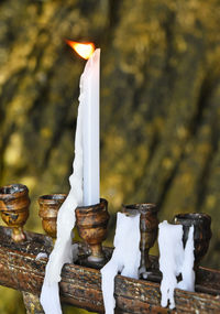 Candle burning outside church