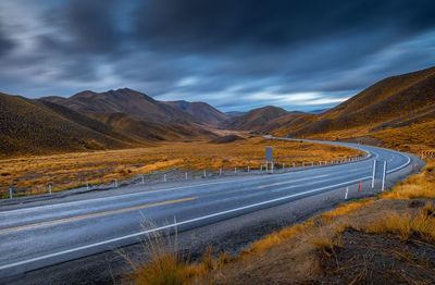 Country road leading towards mountains